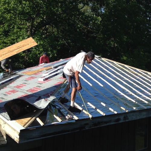 roofer installing radiant barrier roof